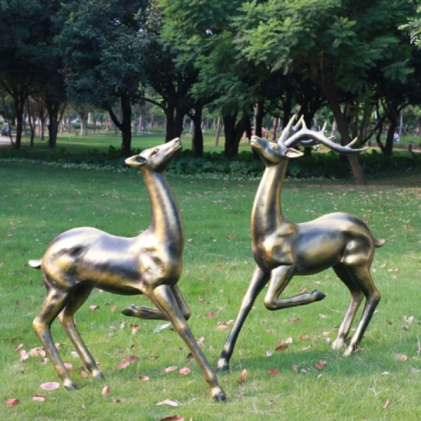 Bronze deer statue on the lawn beside the park - Image 3