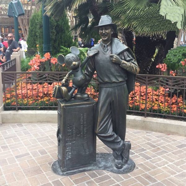 Bronze statue of a middle-aged man wearing a hat on the street in an outdoor park - Image 3