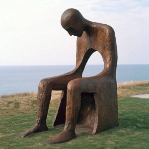 park outdoor grass hesitation man sitting bench bronze statue