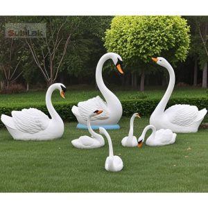 Customized fiberglass swan sculptures of different sizes