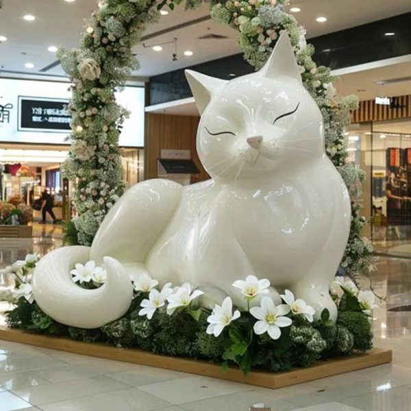 Large fiberglass cat sculpture in indoor shopping mall - Image 4