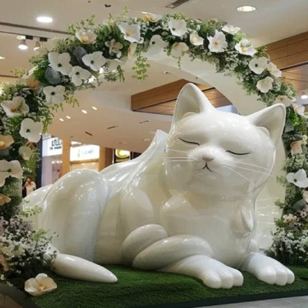 Large fiberglass cat sculpture in indoor shopping mall - Image 3