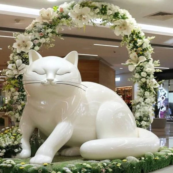 Large fiberglass cat sculpture in indoor shopping mall - Image 2