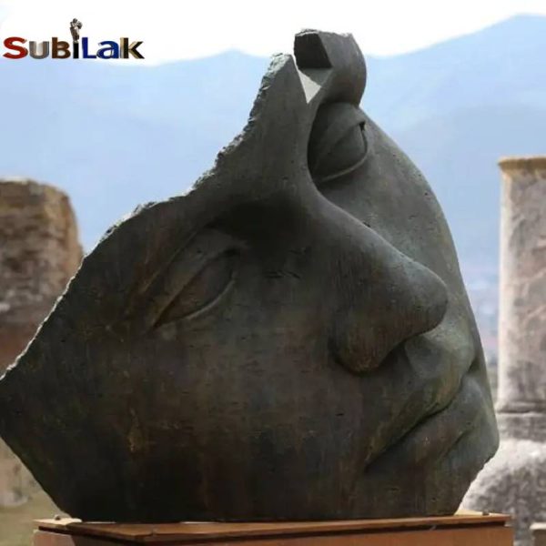 Large bronze incomplete human face sculpture in outdoor park square - Image 4