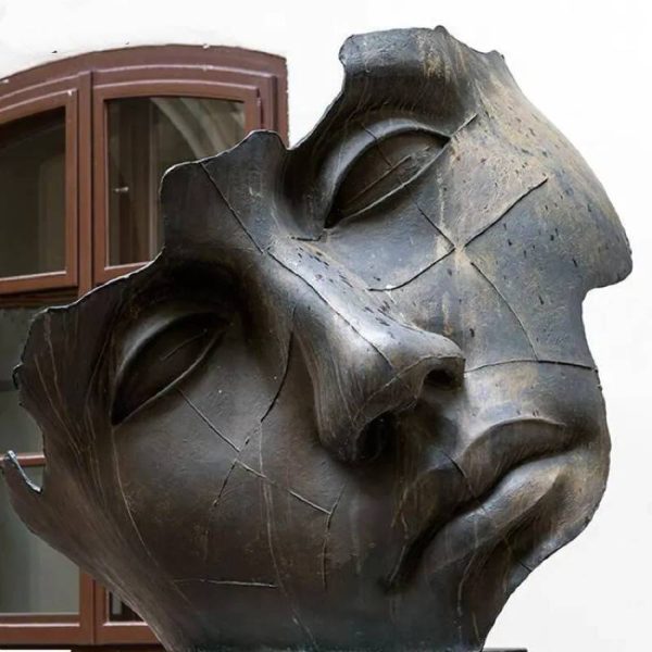 Large bronze incomplete human face sculpture in outdoor park square - Image 3