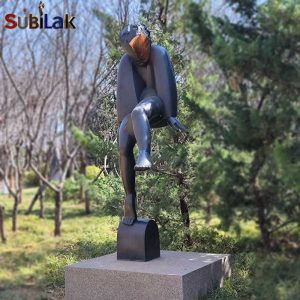 A bronze sculpture of a walking person