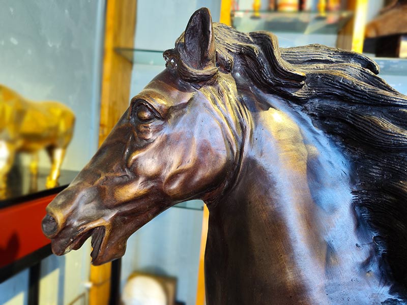Large bronze horse statue: lifelike animal sculpture