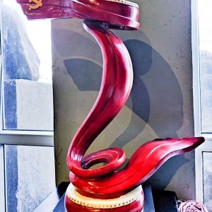 Red abstract streamer drum sculpture