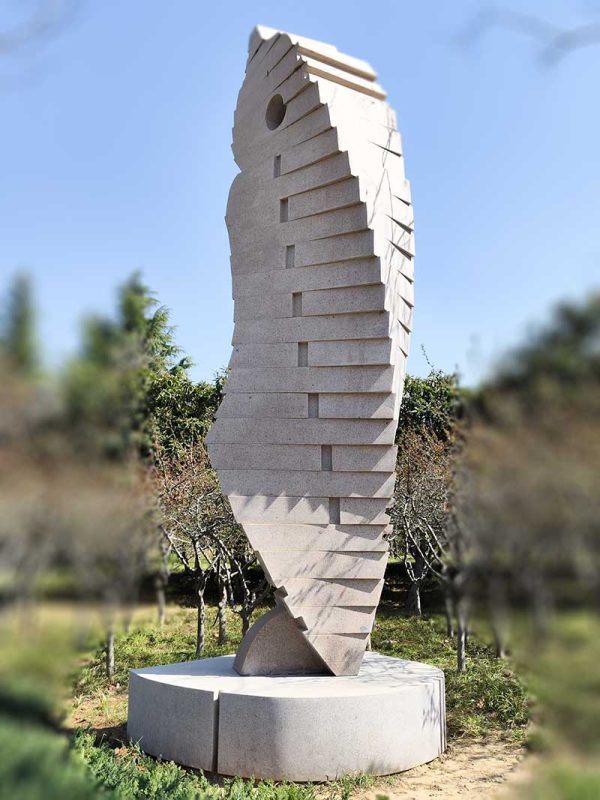 Stone Sculpture: An Abstract Standing Figure Observing and Alert in Twisting