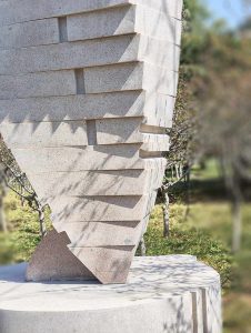Stone Sculpture: An Abstract Standing Figure Observing and Alert in Twisting