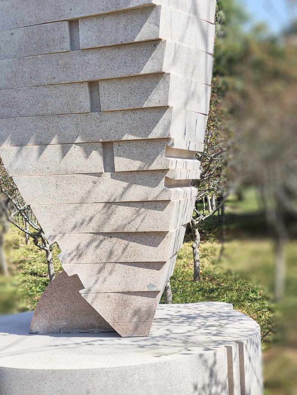 Stone Sculpture: An Abstract Standing Figure Observing and Alert in Twisting