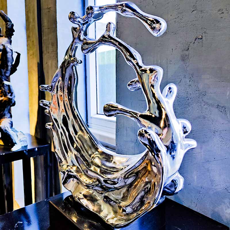 Mirror stainless steel water drop ring sculpture contains flow and vitality
