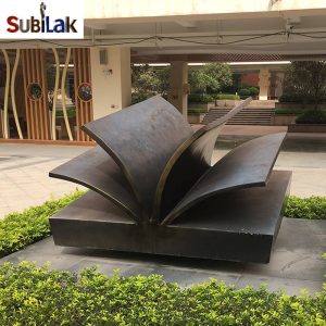 Outdoor campus large bronze book sculpture