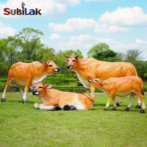 Outdoor park grass fiberglass cow sculpture