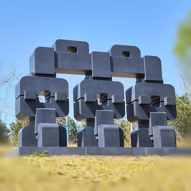 stone sculpture Together expresses the harmonious coexistence of man and nature