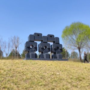 stone sculpture Together expresses the harmonious coexistence of man and nature