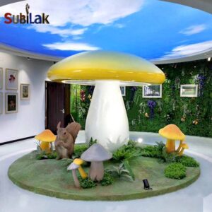 Giant fiberglass mushroom sculpture in outdoor park and indoor