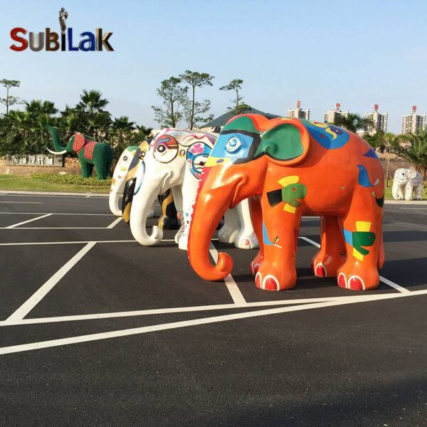 A fiberglass reinforced plastic painted elephant sculpture in an outdoor park