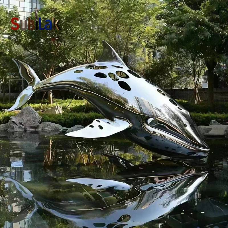 Outdoor stainless steel whale sculpture in the park